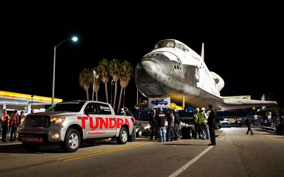 The Toyota Tundra passes history towing an icon space picture #1