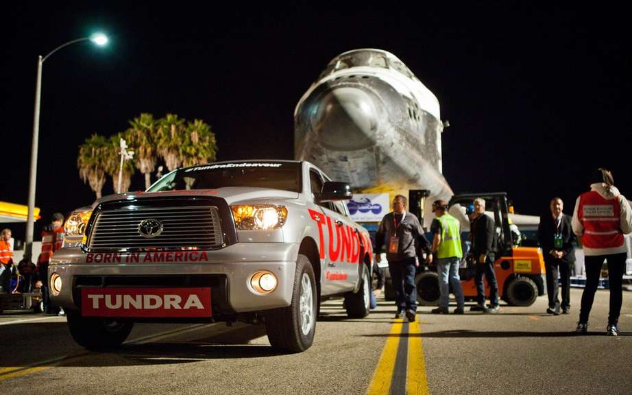 The Toyota Tundra passes history towing an icon space picture #2